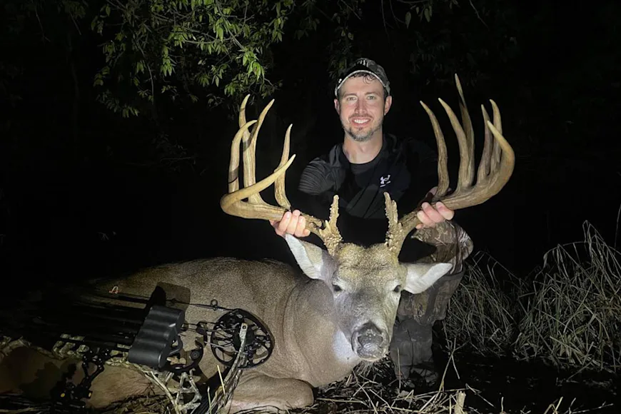 An Oklahoma bowhunter poses with a trophy whitetail.