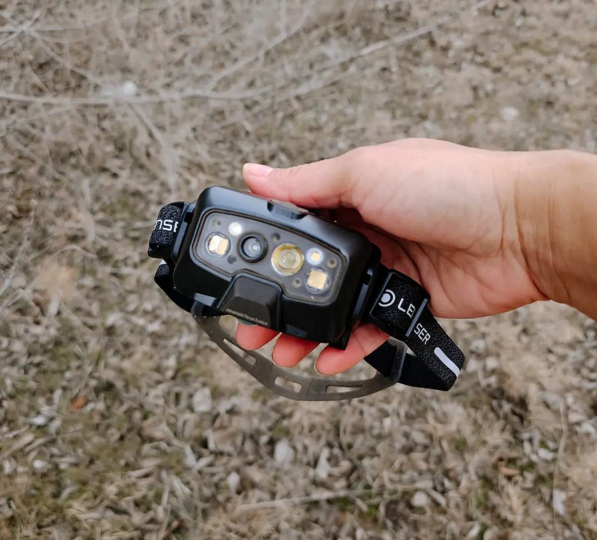 Woman holding Ledlenser Signature Headlamp