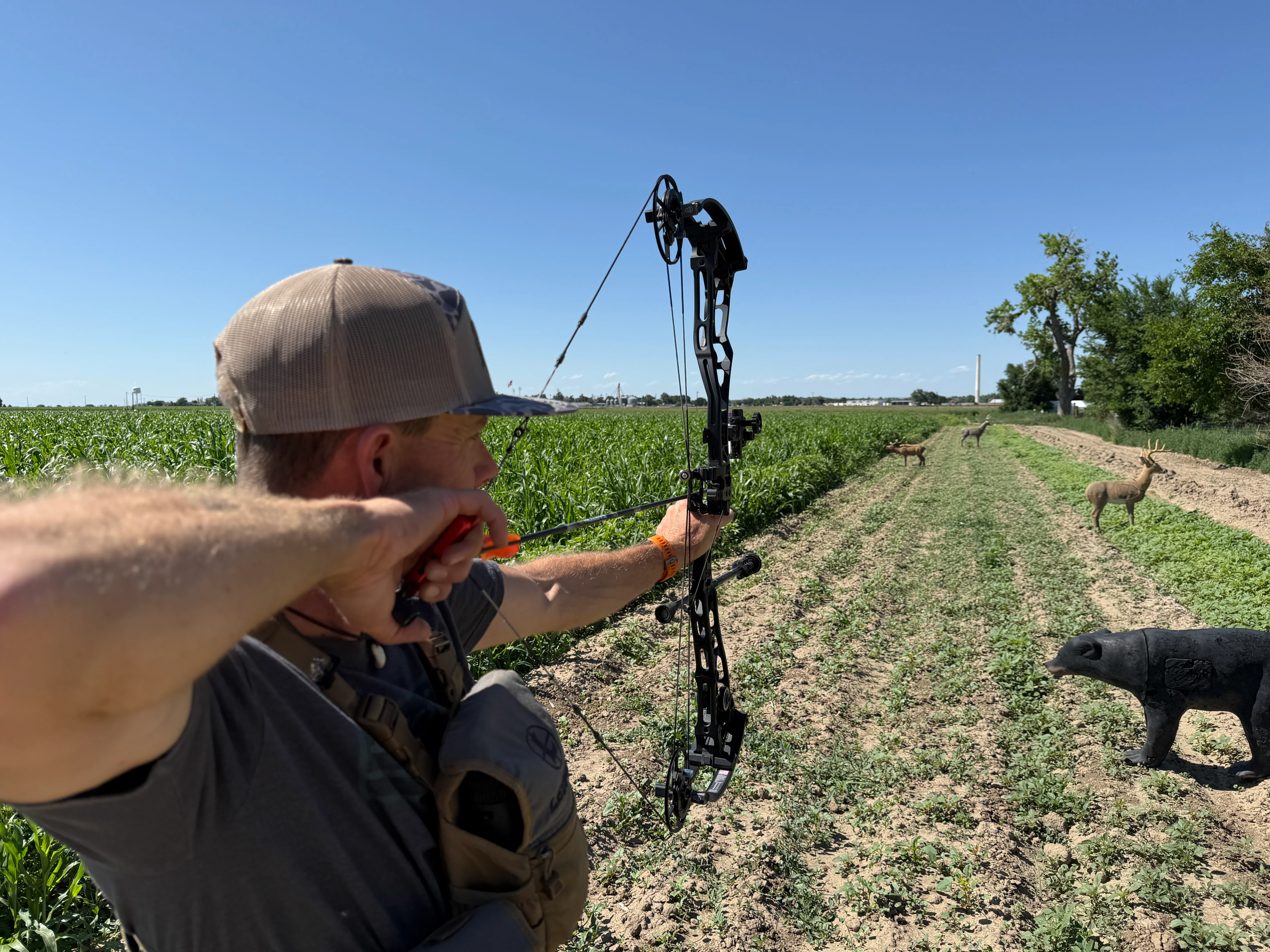 An archer shoots the new Bowtech Proven 34 on an outdoor range. 