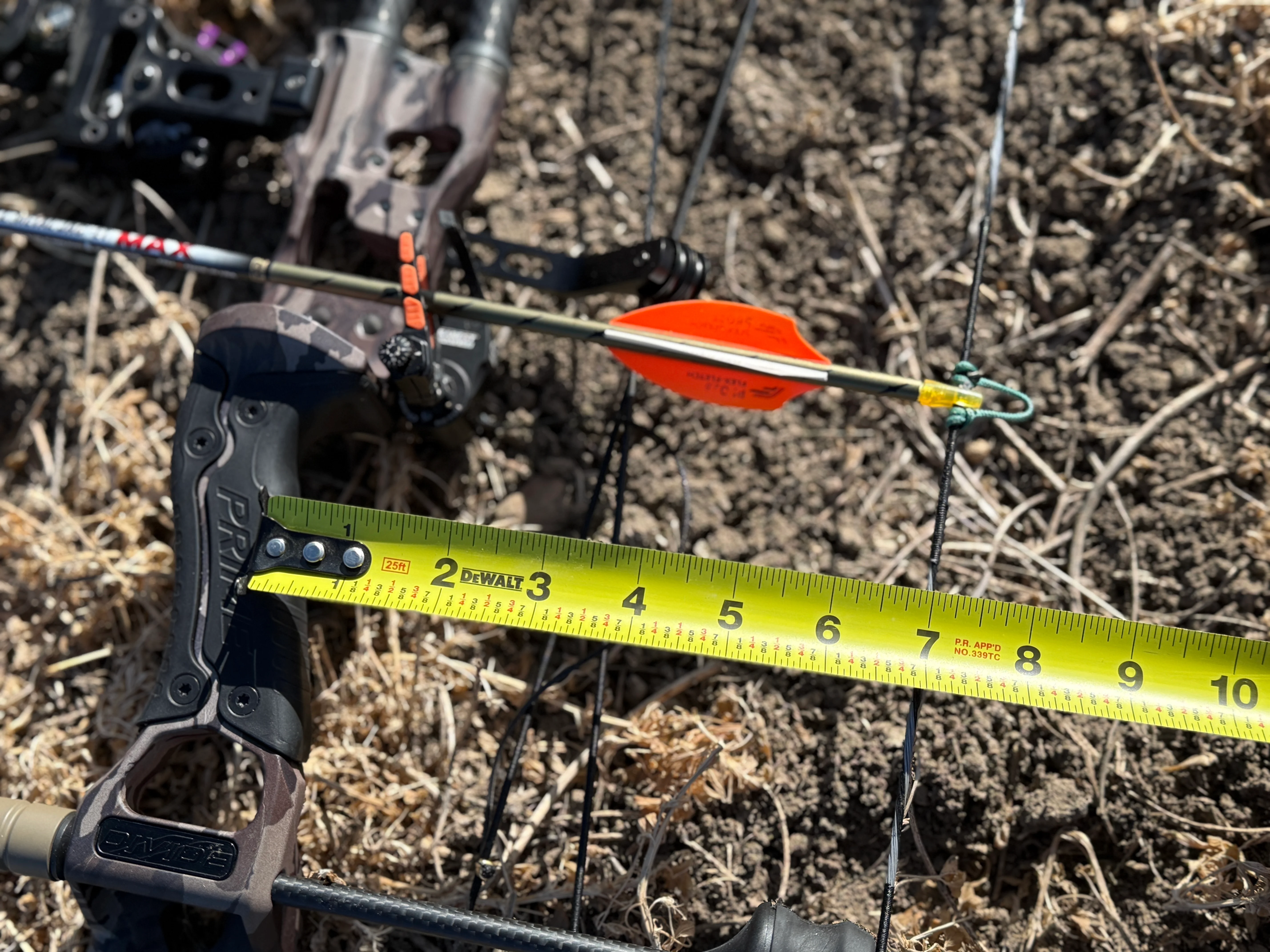 Photo of measuring the Prime Divide's brace height.