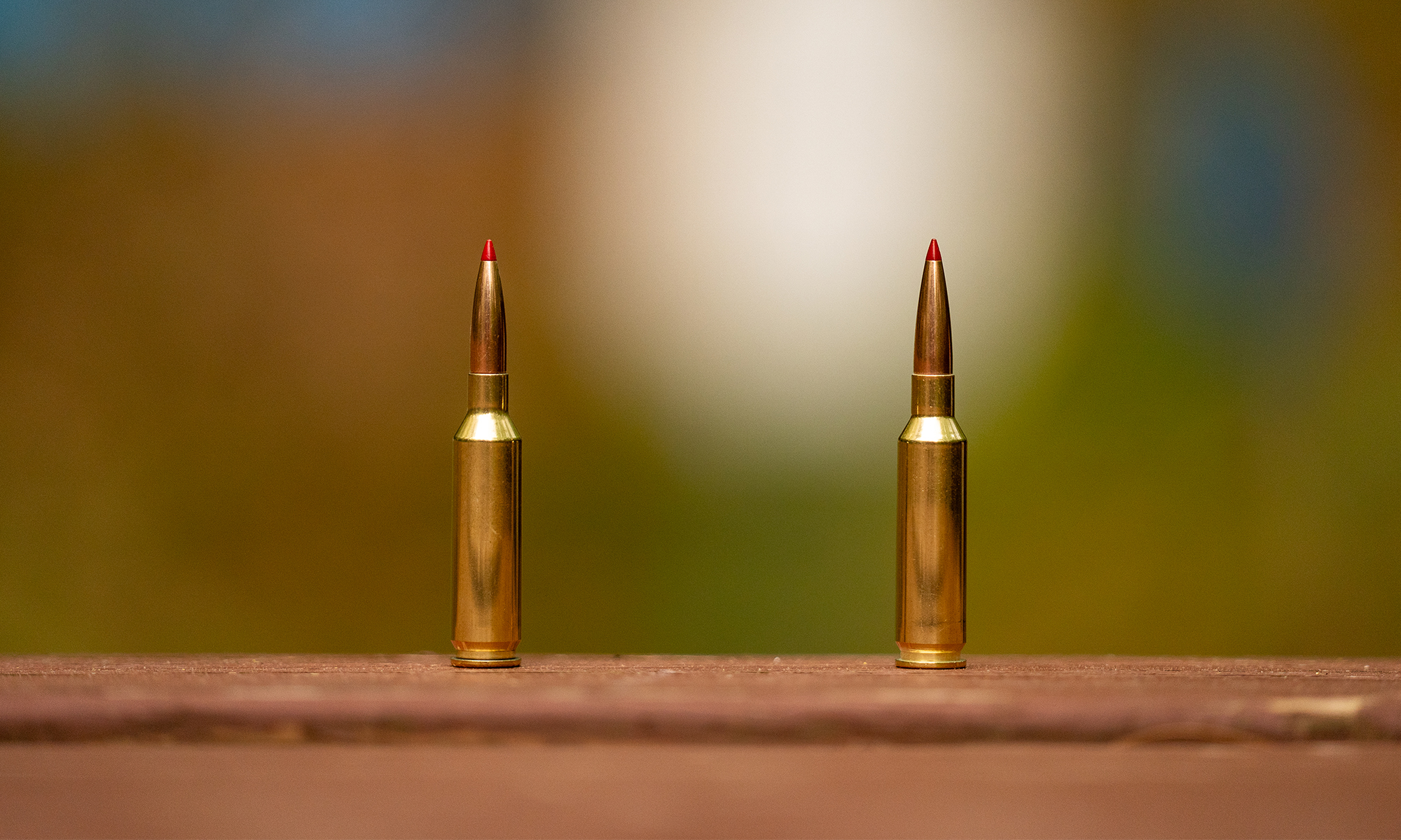 6mm Creedmoor vs 25 Creedmoor, both cartridges standing on a table.