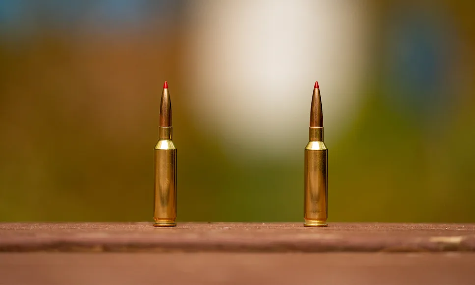 6mm Creedmoor vs 25 Creedmoor, both cartridges standing on a table.