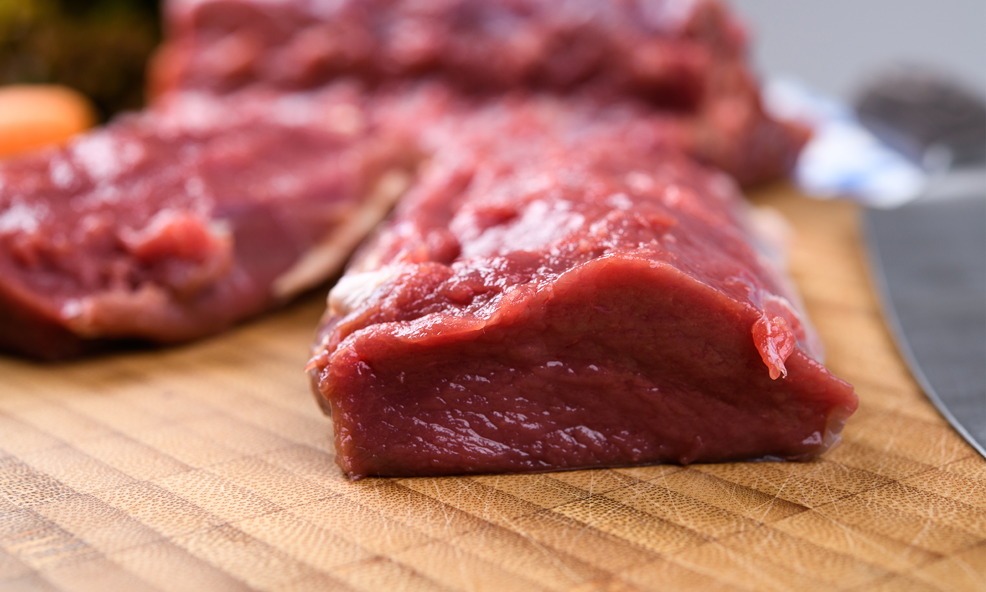 Venison backstrap on a cutting board. 