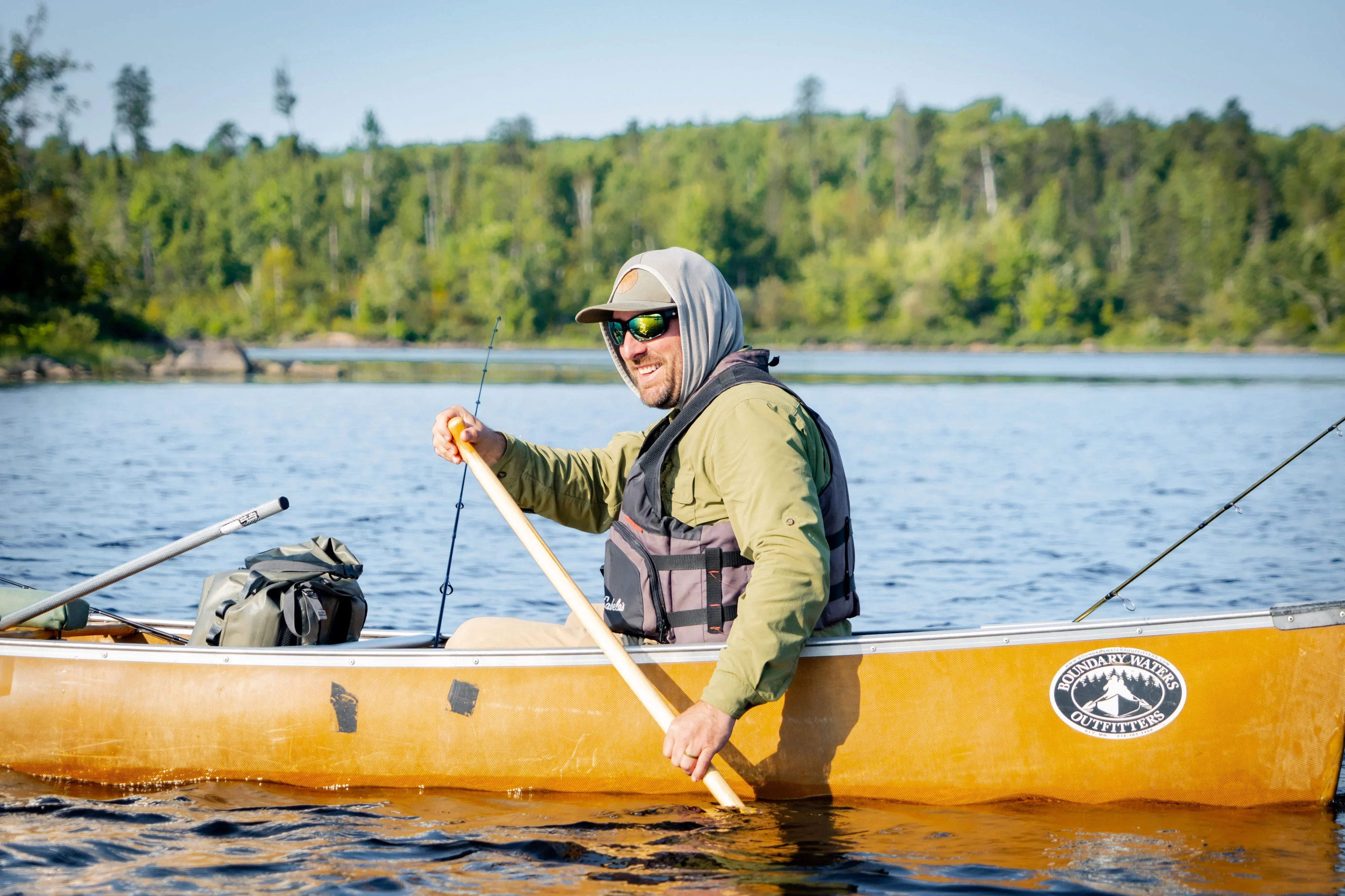 Lukas Leaf paddles a canoe during a fishing trip in the Boundary Waters.