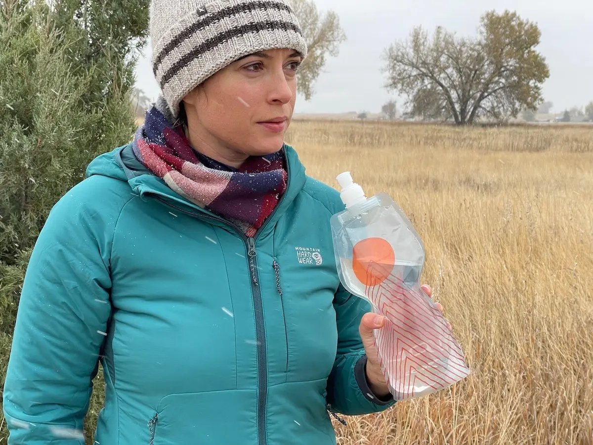 Female hiker drinking from Platypus SoftBottle