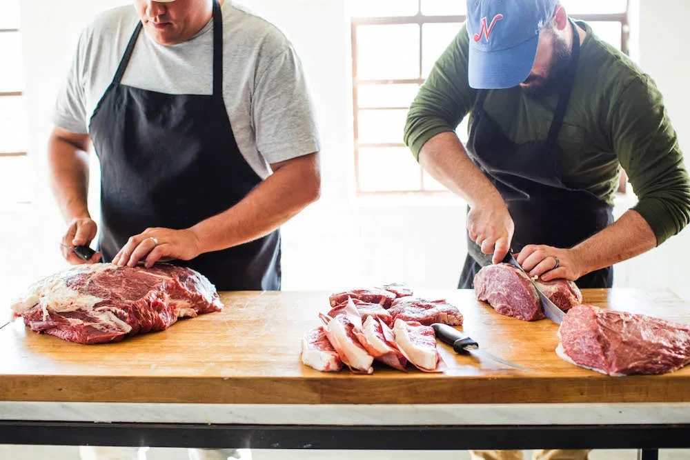 Porter Road founders preparing meat