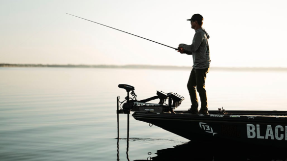 Angler fishing off boat with Minn Kota trolling motor