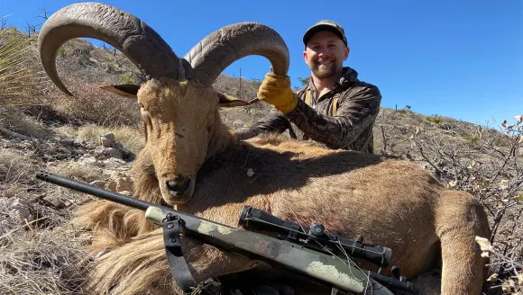 photo of hunter with aoudad