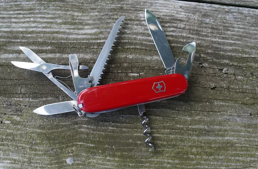 Victorinox Huntsman multi-tool on wood table