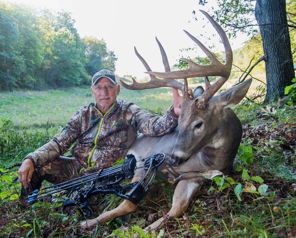 Well-known deer hunter Greg Miller poses with a big whitetail buck taken with a bow. 