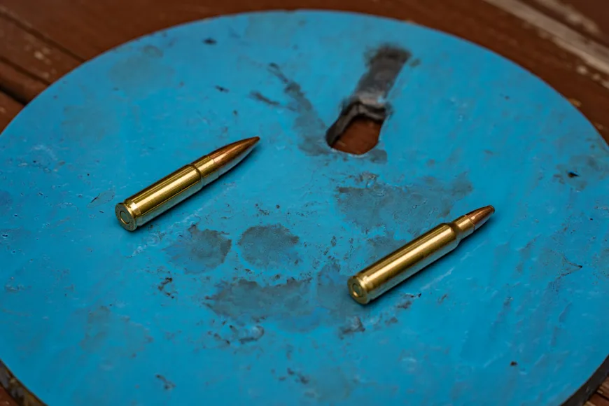 Two 556 Nato cartridges on the left and two 300 Blackout cartridge on right, against white background.