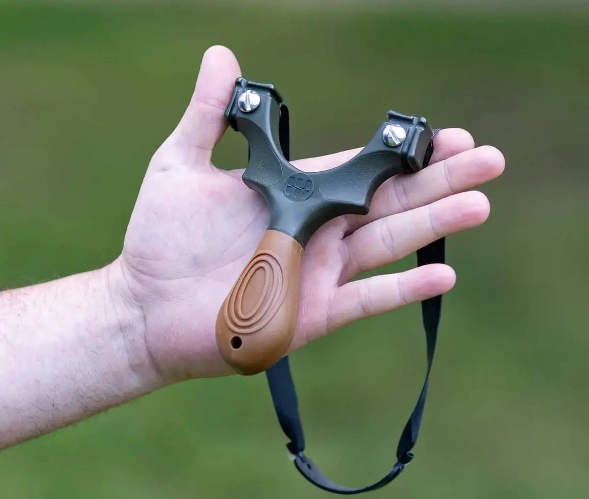 Man holding Scout XT Slingshot