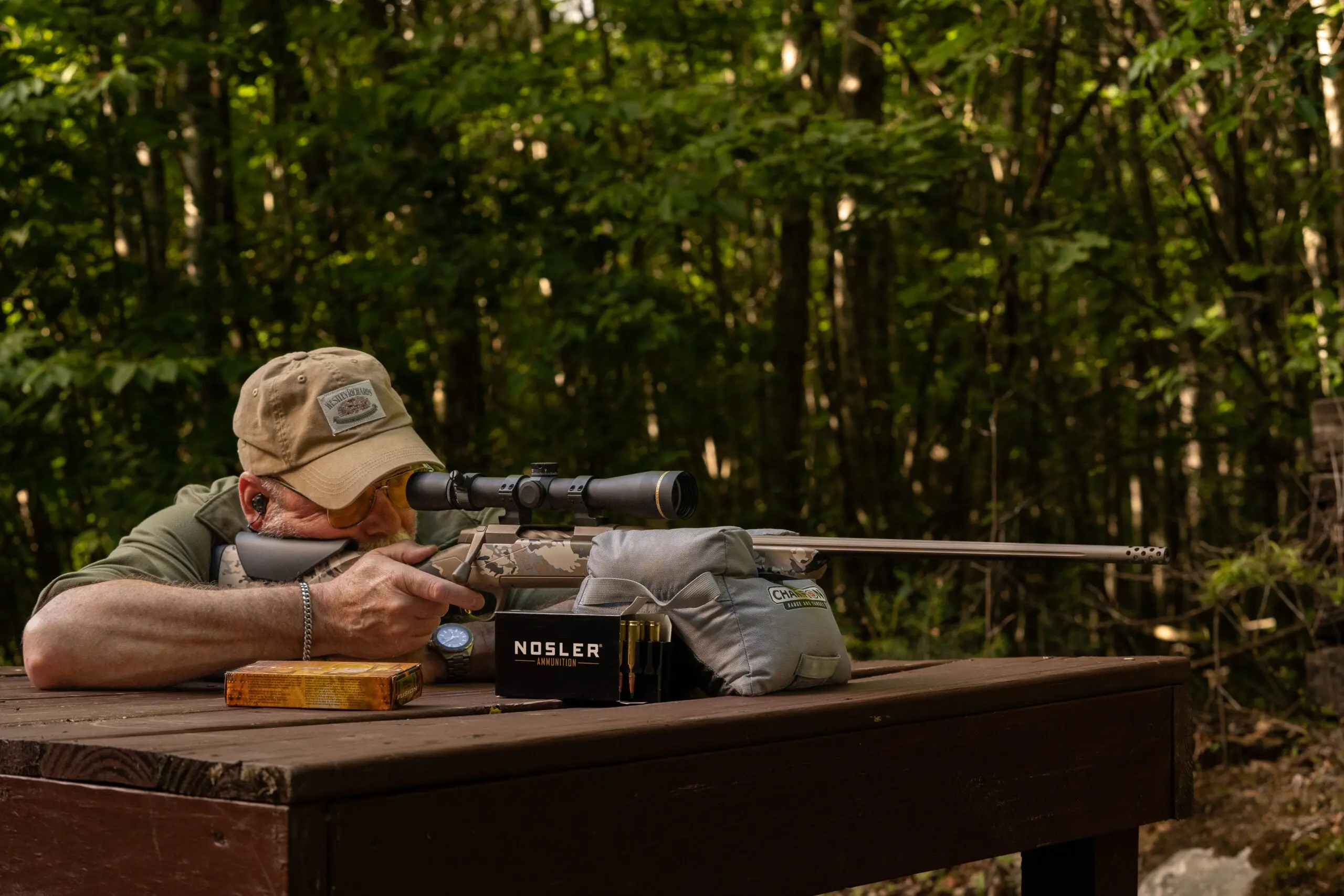 A shooter fires the Browning X-Bolt 2 Speed OVIX MB for accuracy off a bench rest. 