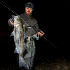 Fisherman with winter striped bass.