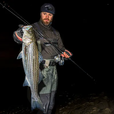 Fisherman with winter striped bass.