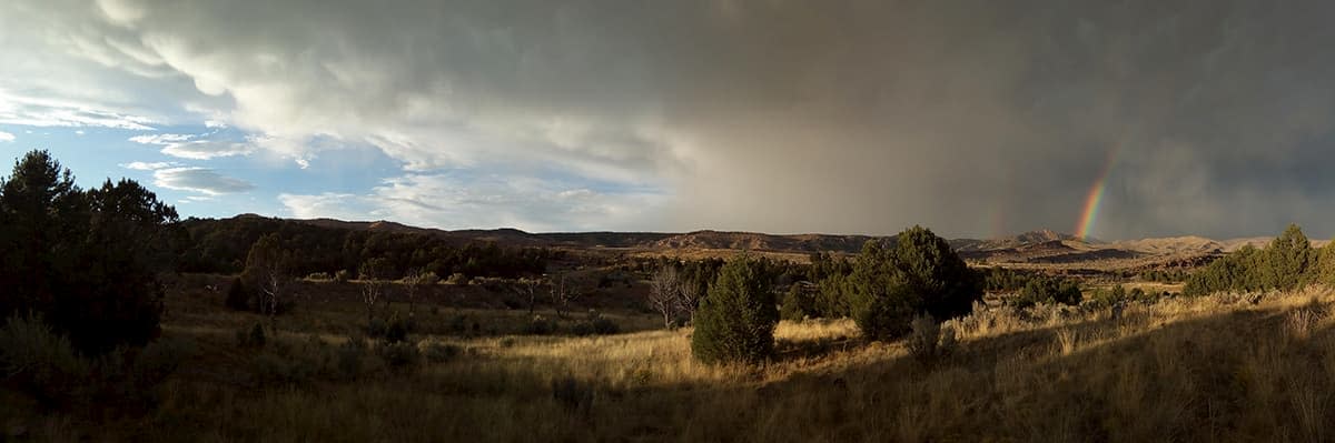 Passing thunderstorm and rainbow