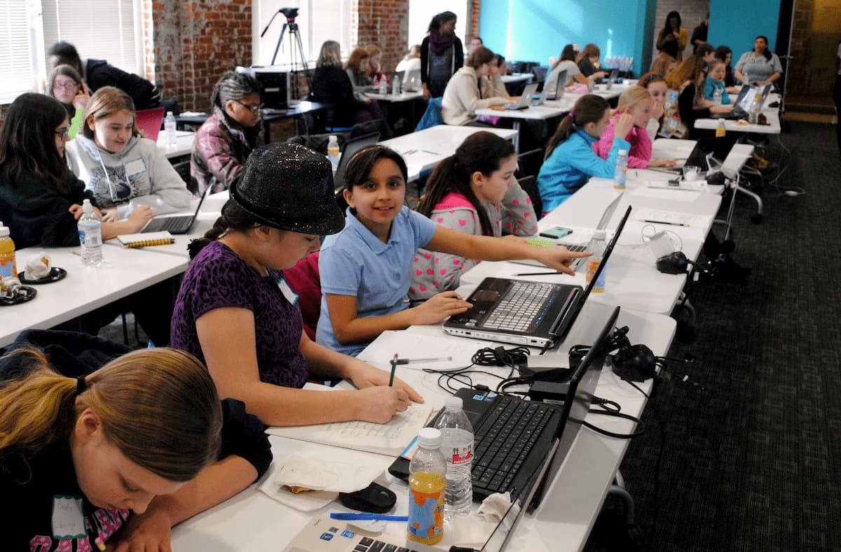 Excited Girl Scouts Building Websites