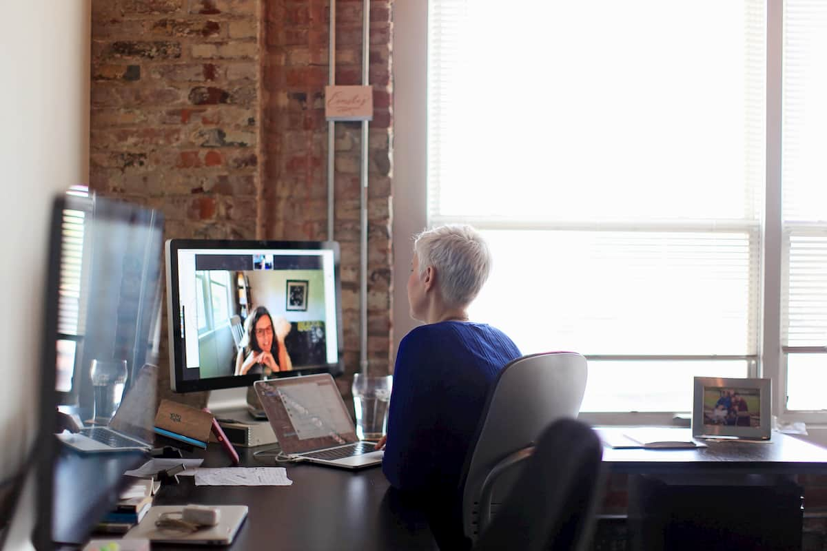 Emily conducts a video call interview with a stakeholder.