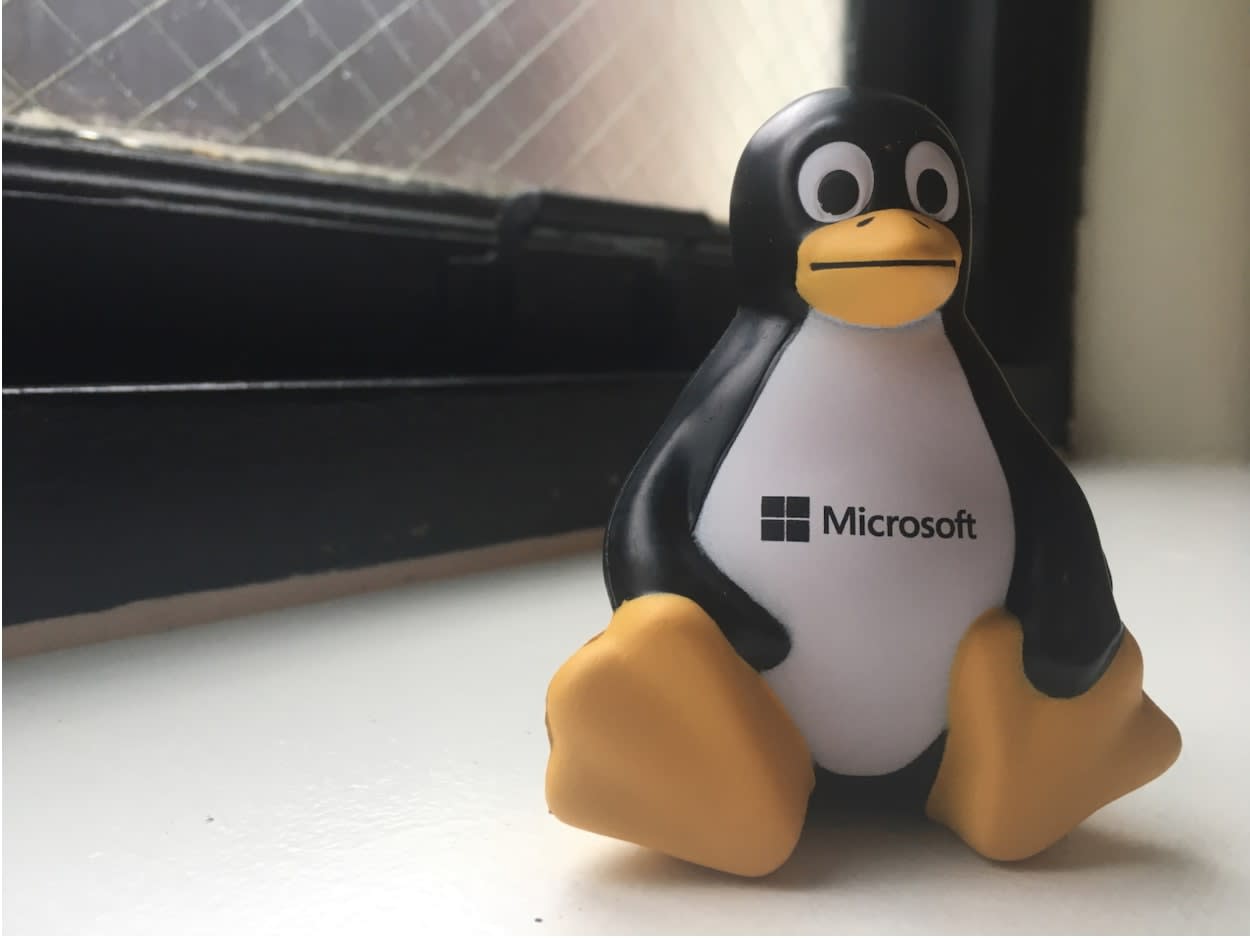 Microsoft penguin toy on a window ledge