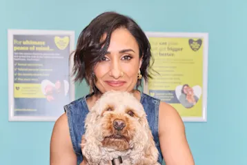 Woman holding dog