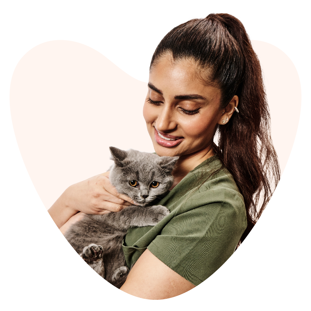 young women holding kitten