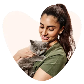 young women holding kitten