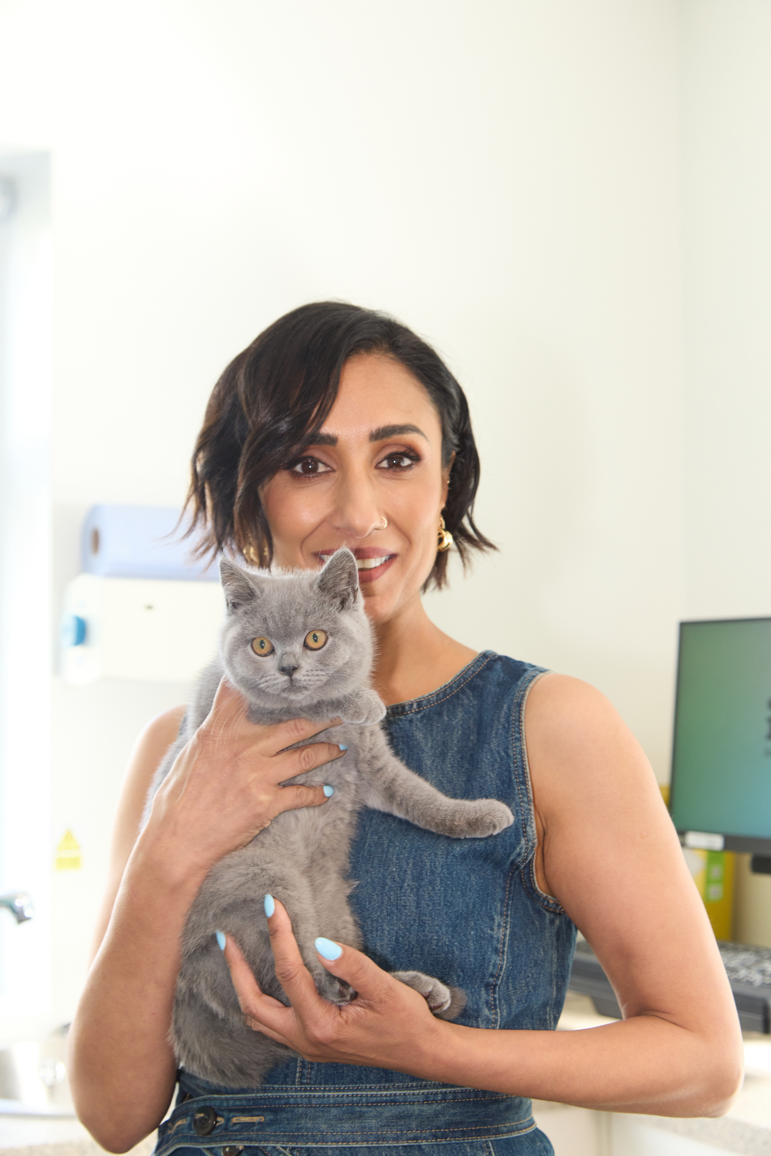 Anita Rani at an ivc vets with a kitten