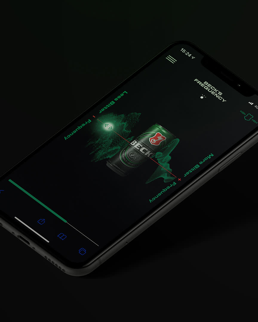A smartphone displaying a dark-themed app screen with a Beck’s beer can, green soundwave graphics, and text reading “BEST FREQUENCY” and “MORE BECK’S + FREQUENCY.” The phone is tilted at an angle on a black background.