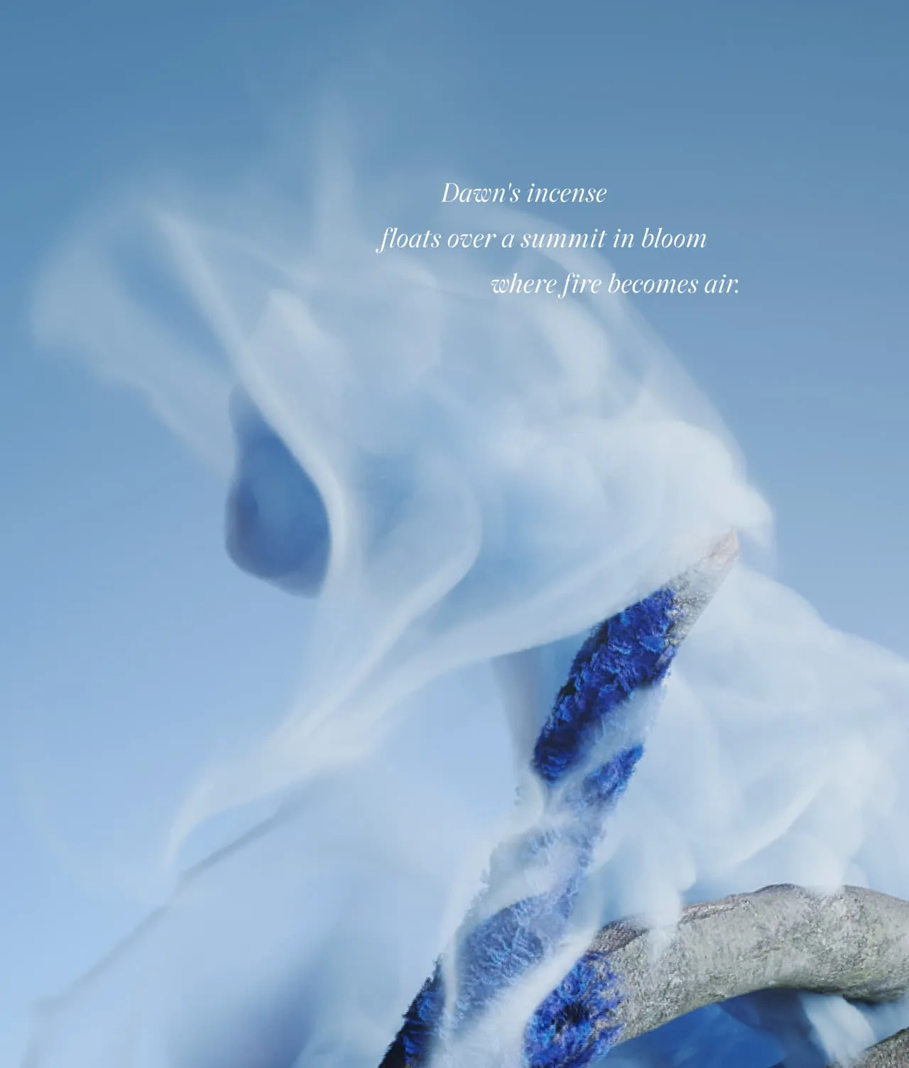Wisps of white smoke swirl around blue-and-white branches against a soft blue background. Text reads: “Dawn’s incense floats over a summit in bloom where fire becomes air.”.