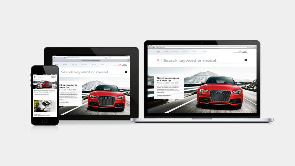 A smartphone, tablet, and laptop display a car website featuring a red Audi driving on a road with mountains in the background, highlighting responsive web design across multiple devices.