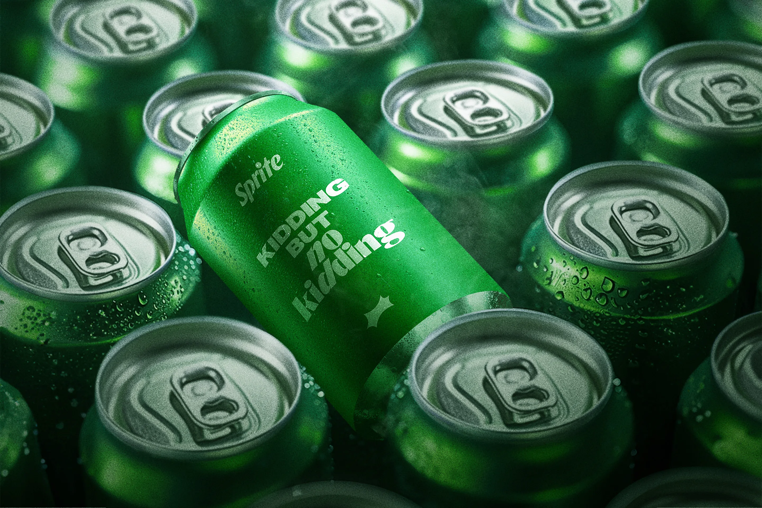 A tilted Sprite can with the text KIDDING BUT NOT Kidding stands out among upright Sprite cans, all covered in cold condensation.