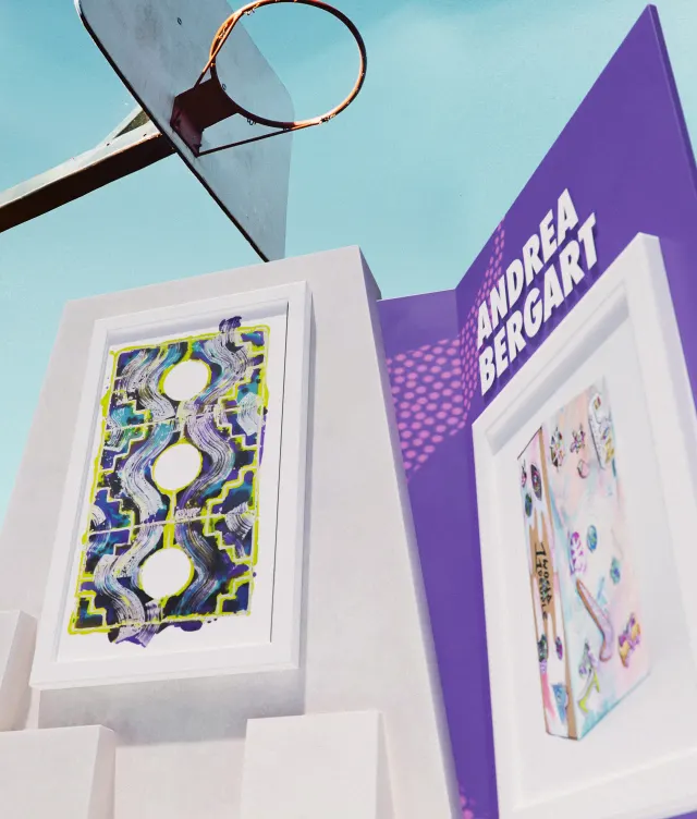A low-angle view of a basketball hoop above an outdoor art display. Two framed artworks are mounted on white structures, with a purple sign reading “ANDREA BERGART” next to them against a clear blue sky.