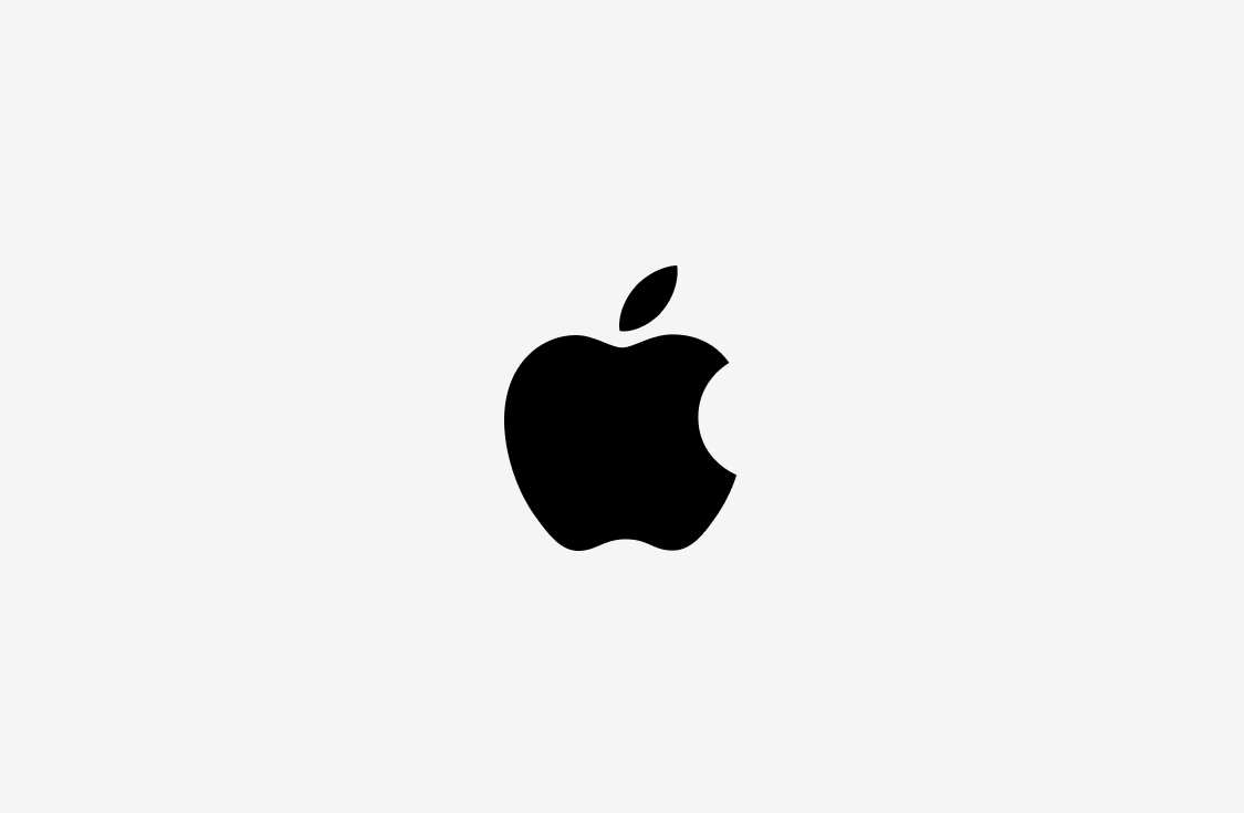 A black Apple logo with a bite taken out of the right side, centered on a plain white background.