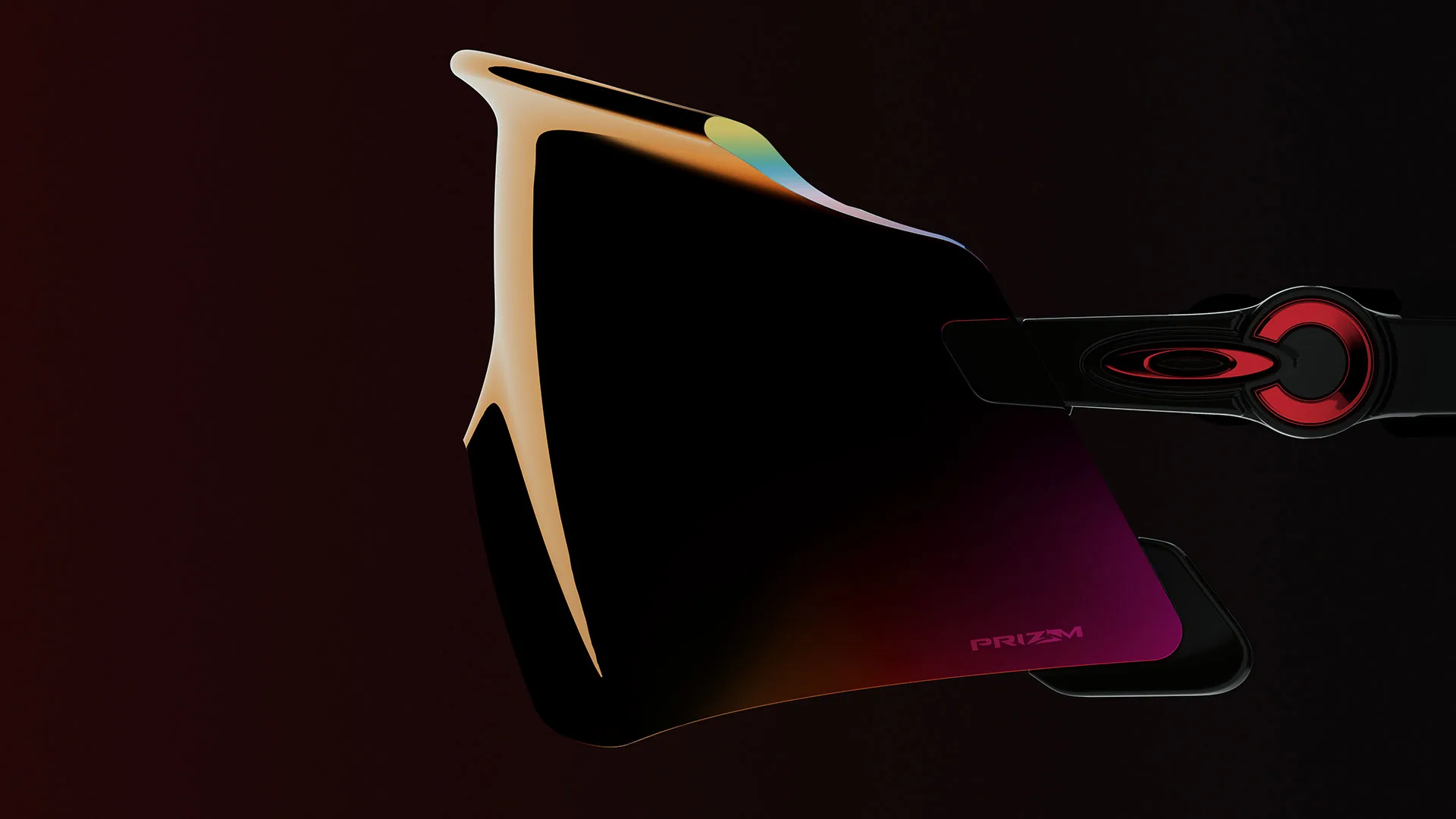 Close-up of a single shield-style sunglasses lens with a gradient tint, attached to a black and red arm, against a dark background. The lens displays the word PRIZM in the lower corner.