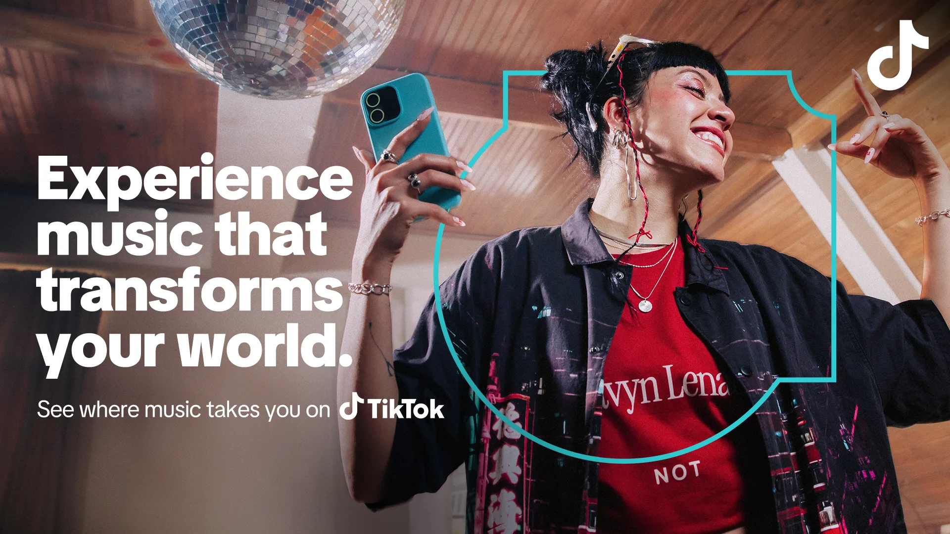 A person with short hair and headphones dances joyfully under a disco ball, holding a phone. Text reads: Experience music that transforms your world. See where music takes you on TikTok. TikTok logo is in the corner.