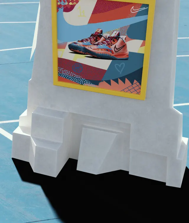 A colorful poster featuring a red and blue athletic shoe is displayed on a white, geometric stand on a blue outdoor court. The poster has abstract patterns and yellow, red, and blue accents.