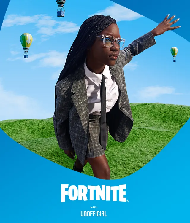 A woman in a plaid suit poses mid-stride on a grassy hill with her arm outstretched. Hot air balloons float in the blue sky. The Fortnite with Unofficial logo appears at the bottom.