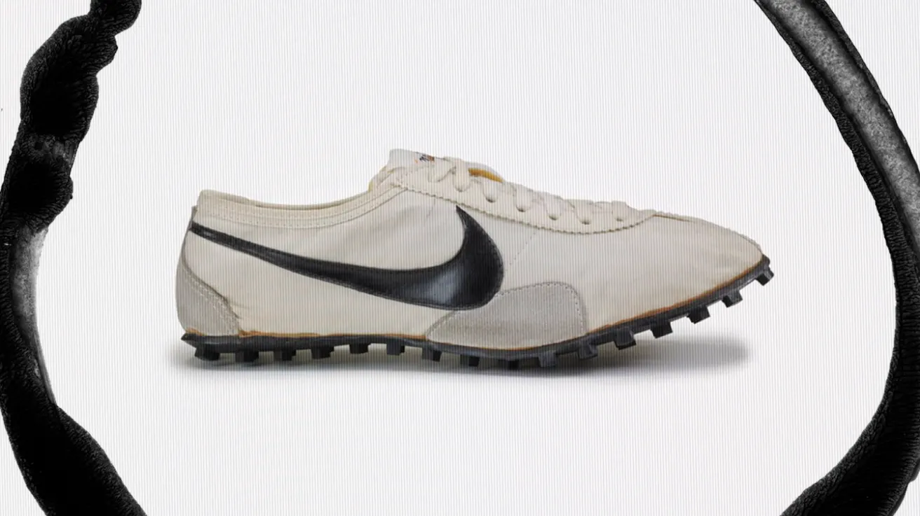 A vintage white sneaker with a black swoosh logo and textured black sole is displayed on a plain background, partially framed by a bold, curved black brushstroke.