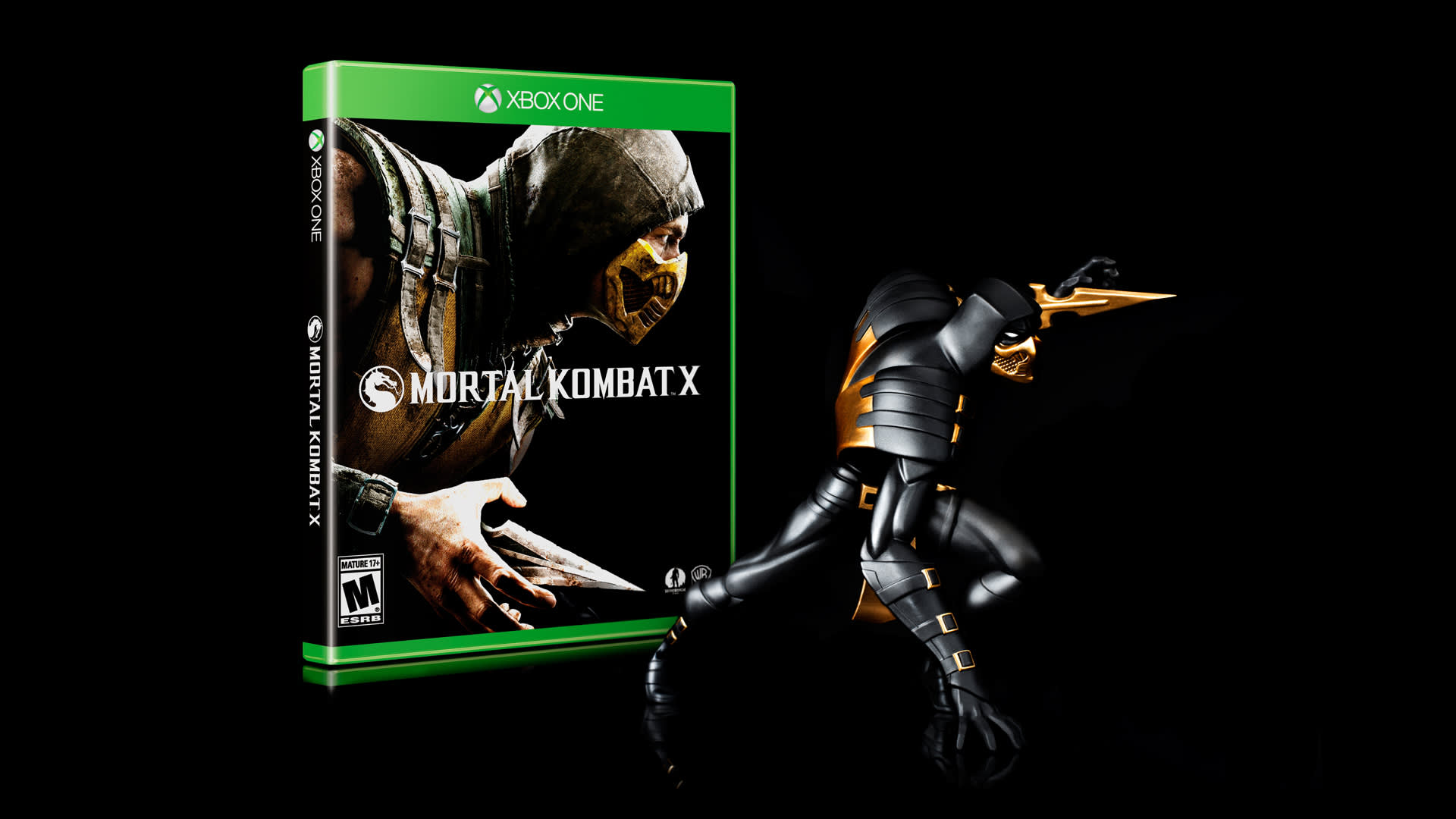 A figurine of a masked fighter with swords poses next to an Xbox One case for Mortal Kombat X against a black background. The cover shows a similar masked character in a combat stance.