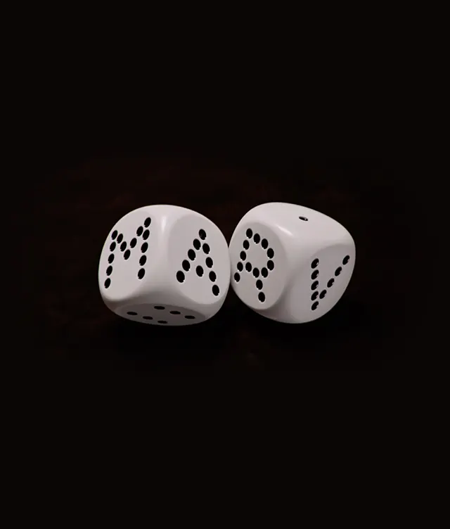 Two white dice on a dark background, with the dots on each die arranged to spell out the word MARV.
