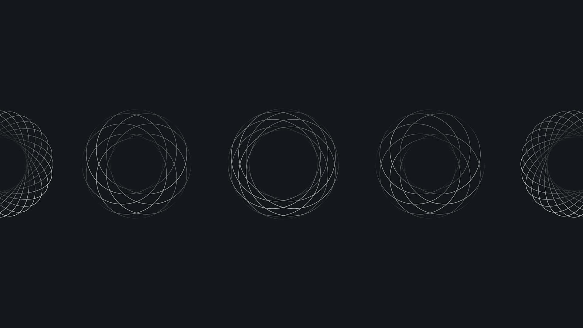 Four geometric, circular patterns made of overlapping thin lines are evenly spaced across a dark background, with partial patterns visible at the left and right edges.