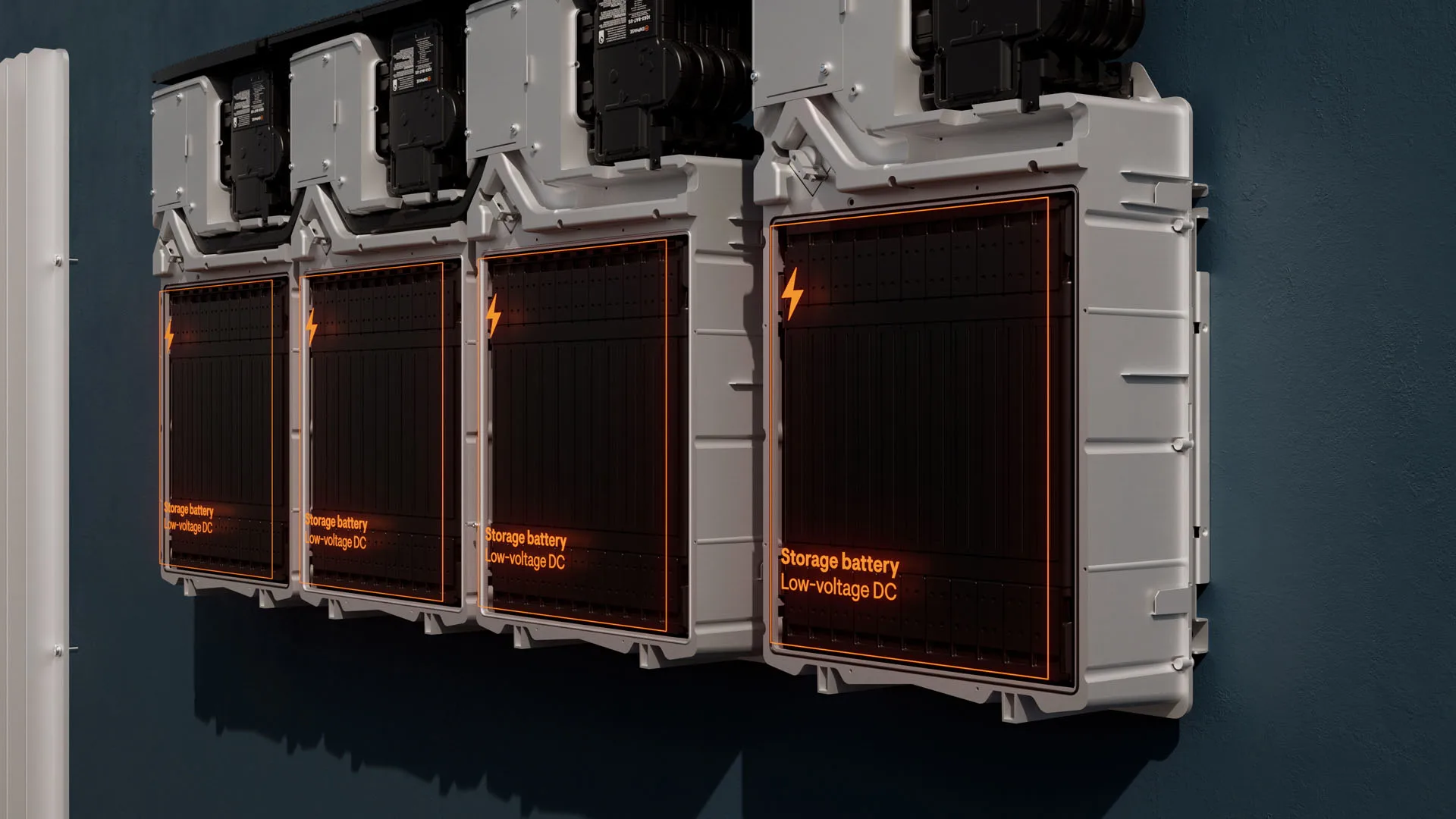Four wall-mounted storage battery units labeled “Storage battery Low-voltage DC” with illuminated orange text, are arranged in a row against a dark wall in a modern setting.