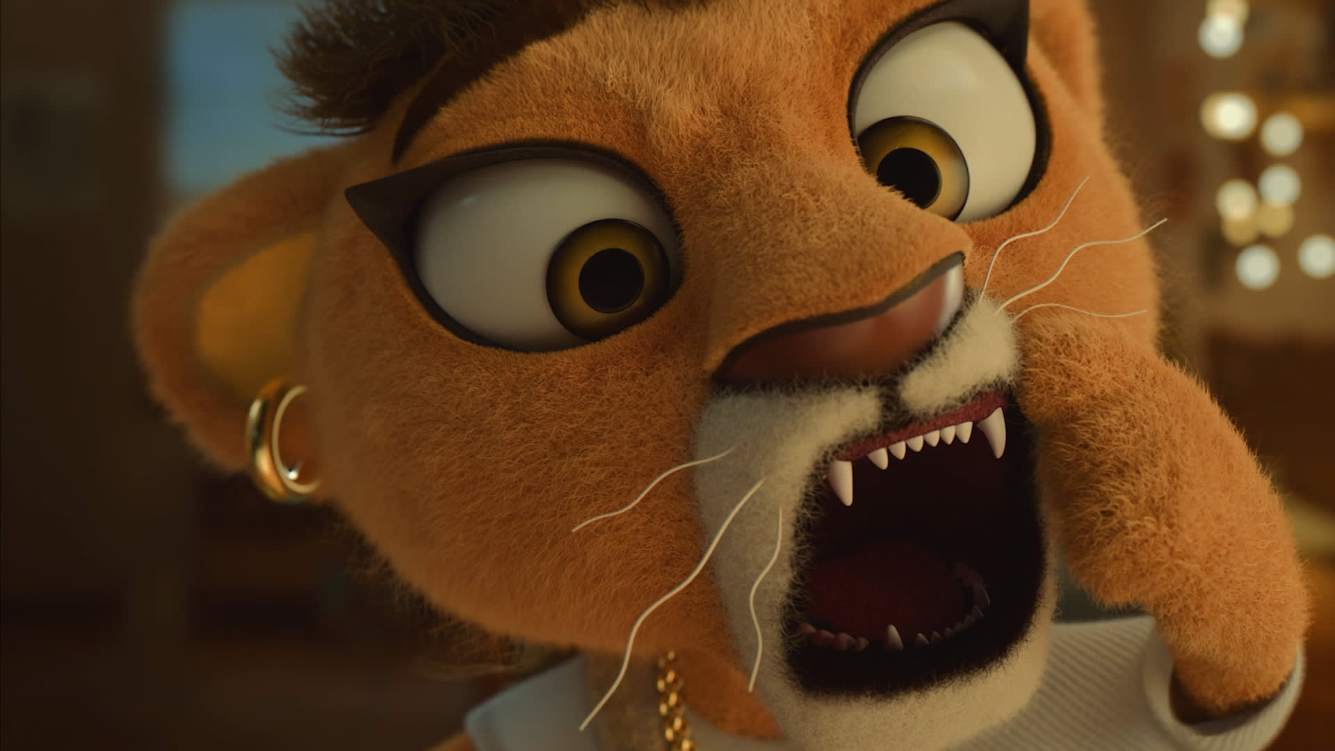 A close-up of an animated lion character with wide eyes, sharp teeth, and a surprised or shocked expression. It is wearing earrings, a gold chain, and appears to be mid-roar or gasp.