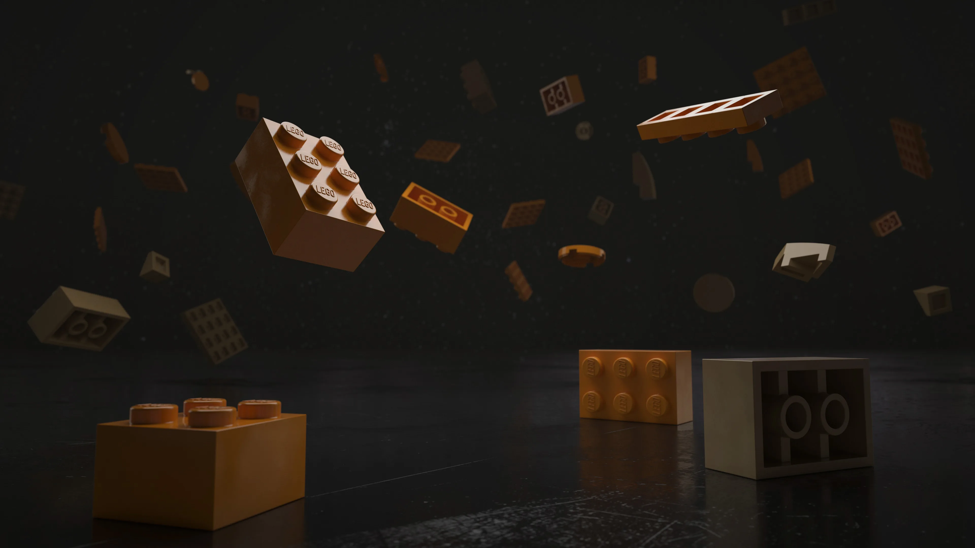 Several yellow and orange toy building bricks float in the air against a dark background, while a few bricks rest on a shiny black surface in the foreground.