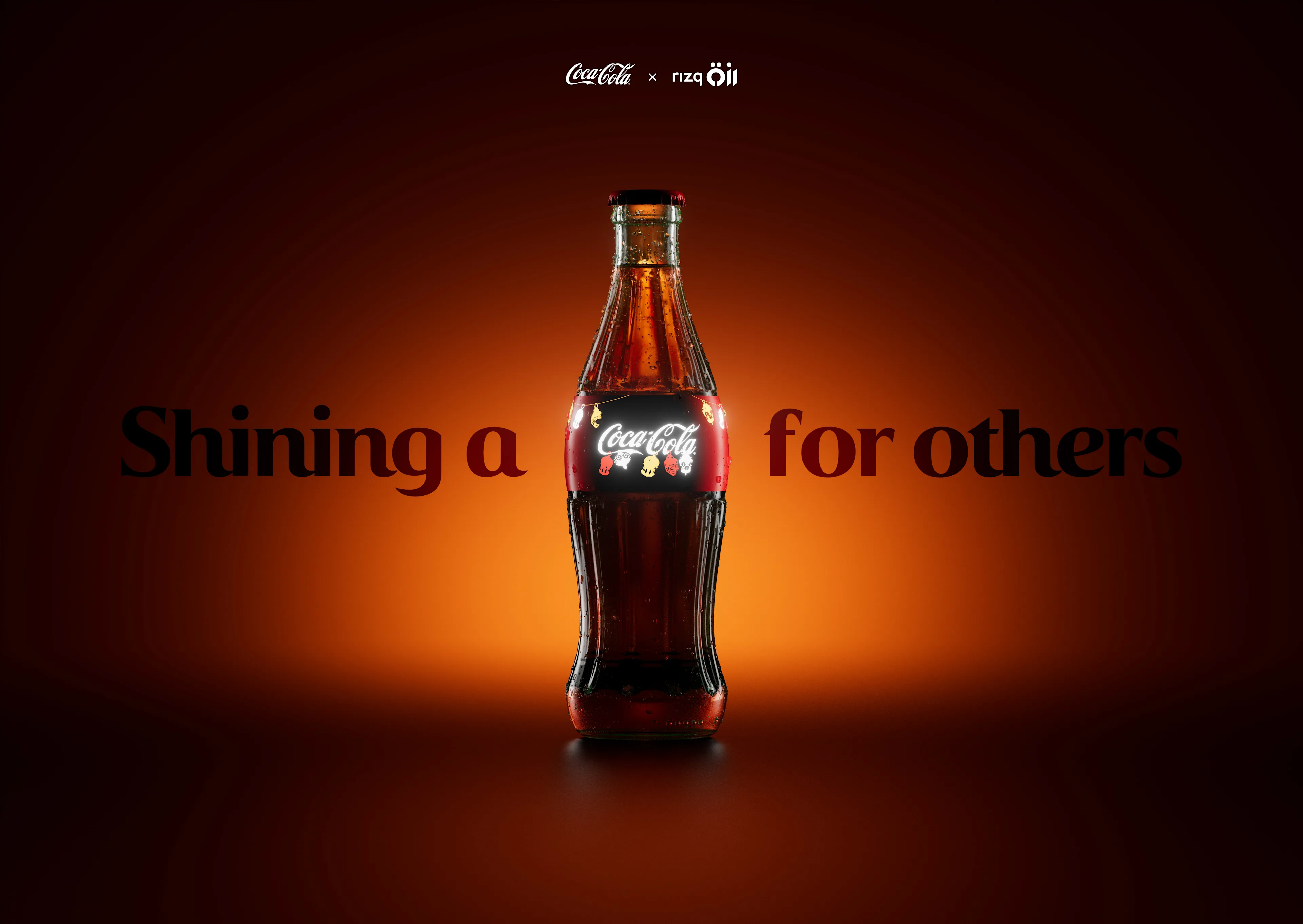 A Coca-Cola bottle glowing with light, centered against a gradient orange background. The words “Shining a” appear on the left and “for others” on the right, with the light from the bottle replacing a missing word.