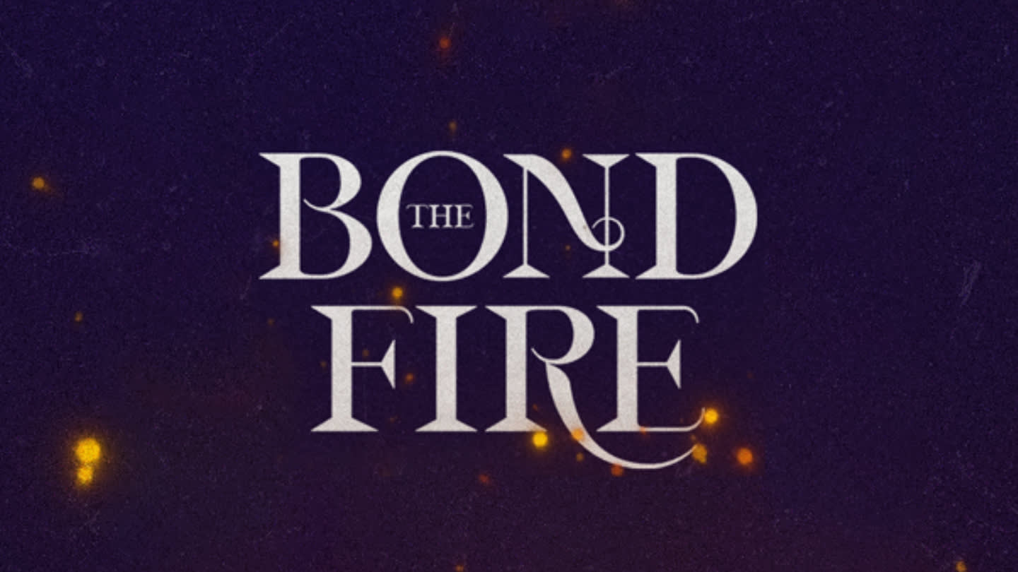Text reading “The Bond Fire” in elegant serif font on a dark background with glowing orange embers scattered throughout, creating a warm, fiery atmosphere.