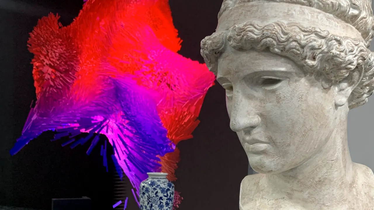A marble statue of a womans head is in the foreground, with a blue-and-white ceramic vase and a vivid red and purple abstract 3D art installation in the background.
