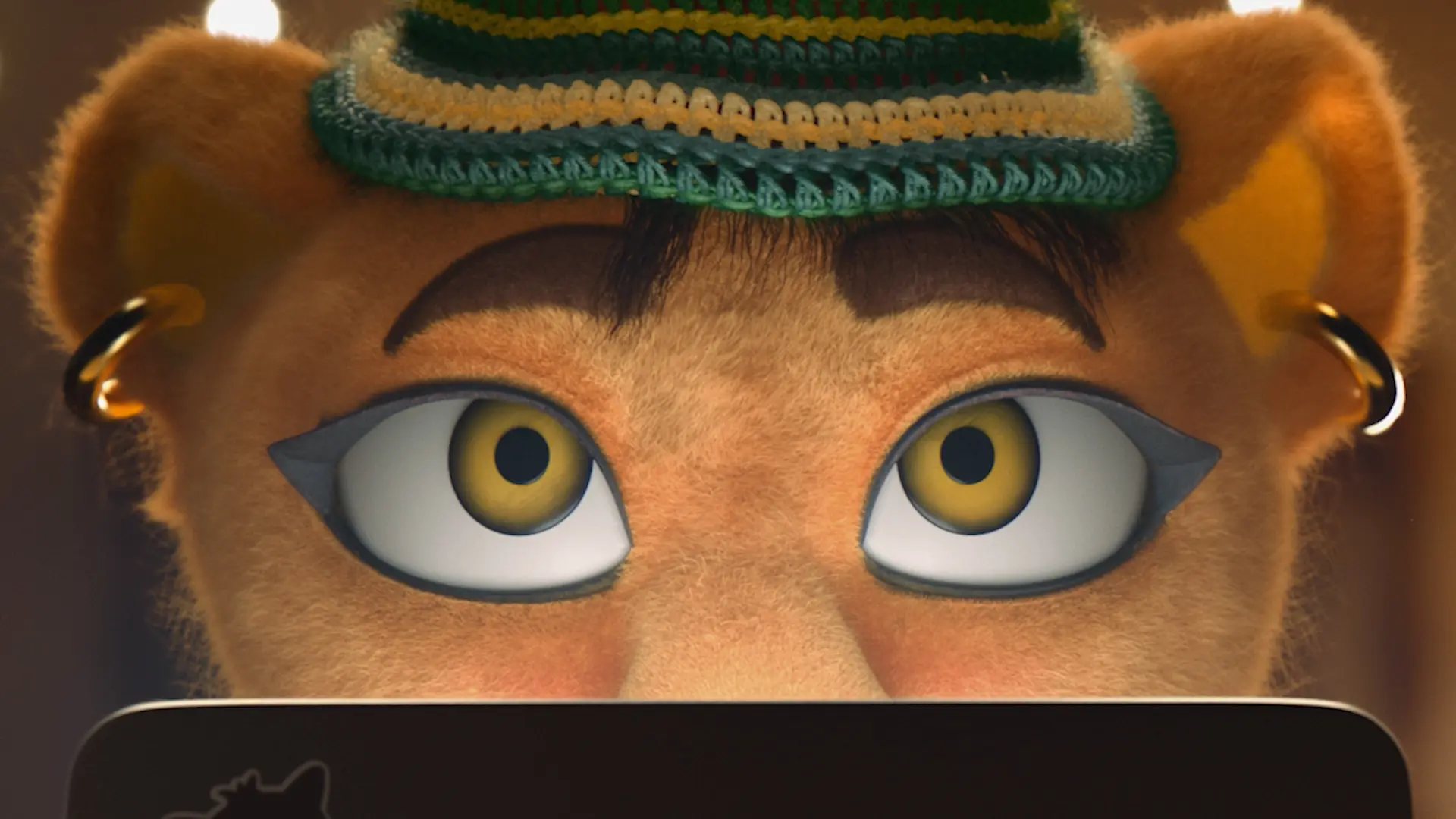 A close-up of an animated feline character with golden fur, large yellow eyes with black eyeliner, gold hoop earrings, and a green-striped crocheted hat, peering over the top edge of a laptop.