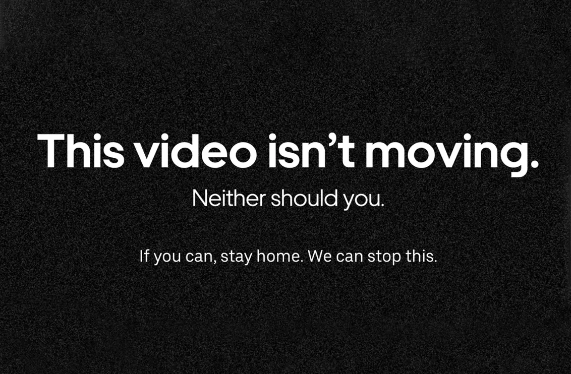 White text on a black background reads: This video isnt moving. Neither should you. If you can, stay home. We can stop this.
