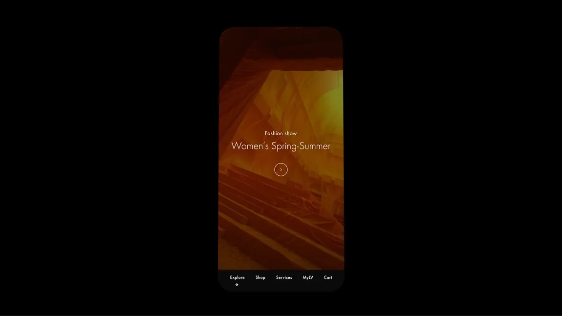 A mobile phone screen displaying a Louis Vuitton website interface for a Womens Spring-Summer fashion show, featuring navigation icons at the bottom.